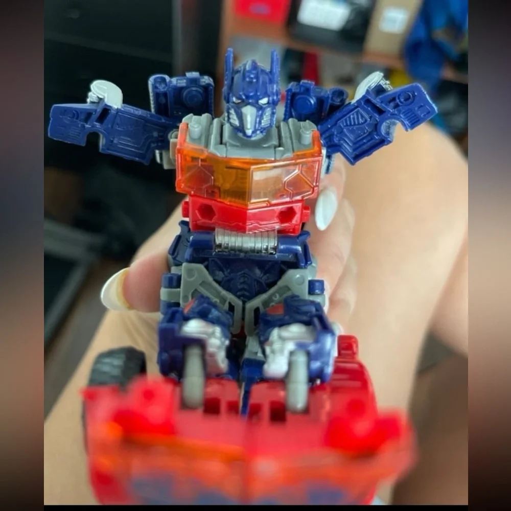 Hasbro Transforming Robot - Red, Blue, and Silver